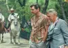 Julian Noble (PIERCE BROSNAN) and Mr. Randy (PHILIP...erved.